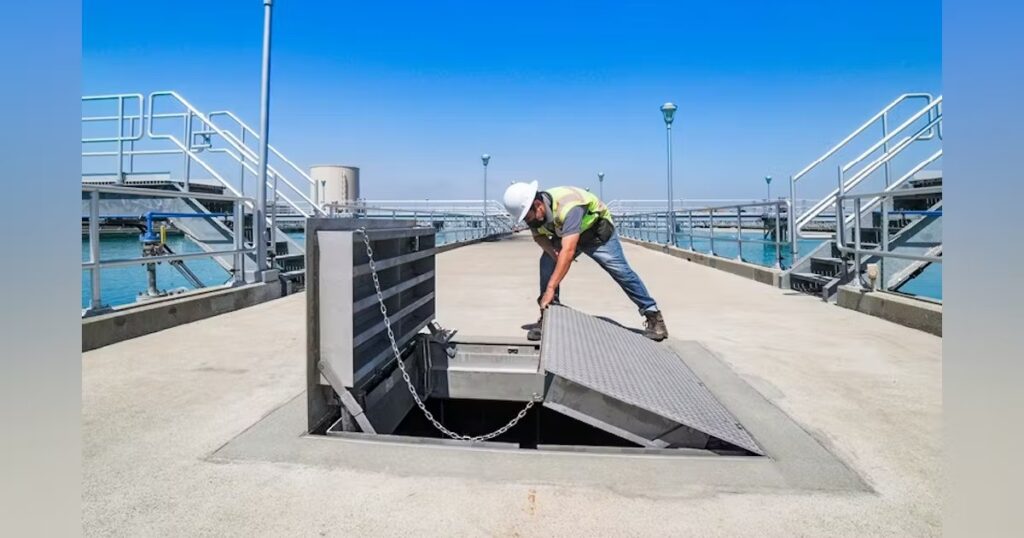 Worker installing a solar panel system on a rooftop.