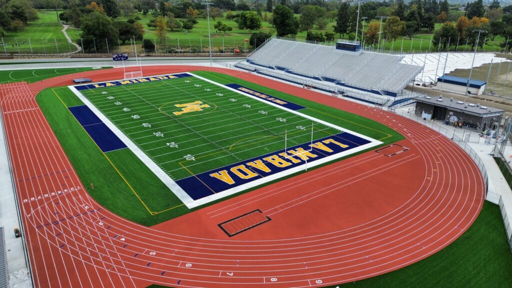 Aerial view of a football field with 'LUBBOCK' written in the end zone.