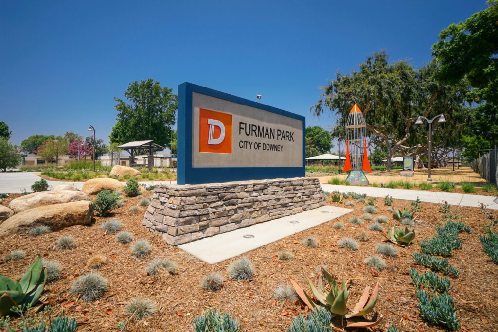 Entrance sign for Durham Park apartment homes on a sunny day.