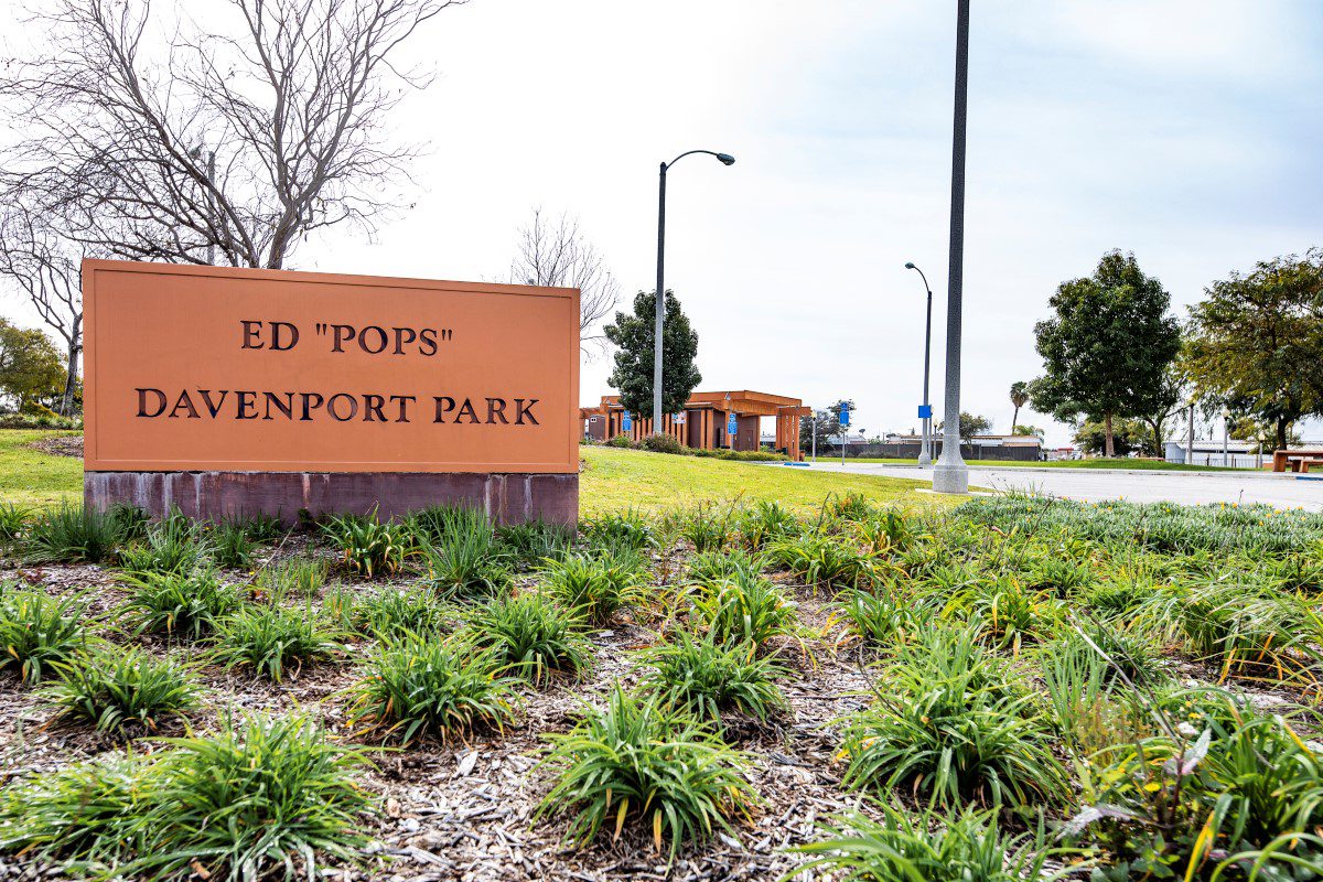 Entrance sign for Ed 'Pops' Davenport Park surrounded by greenery.