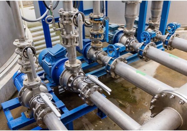 Industrial pipes and valves connected in a system.